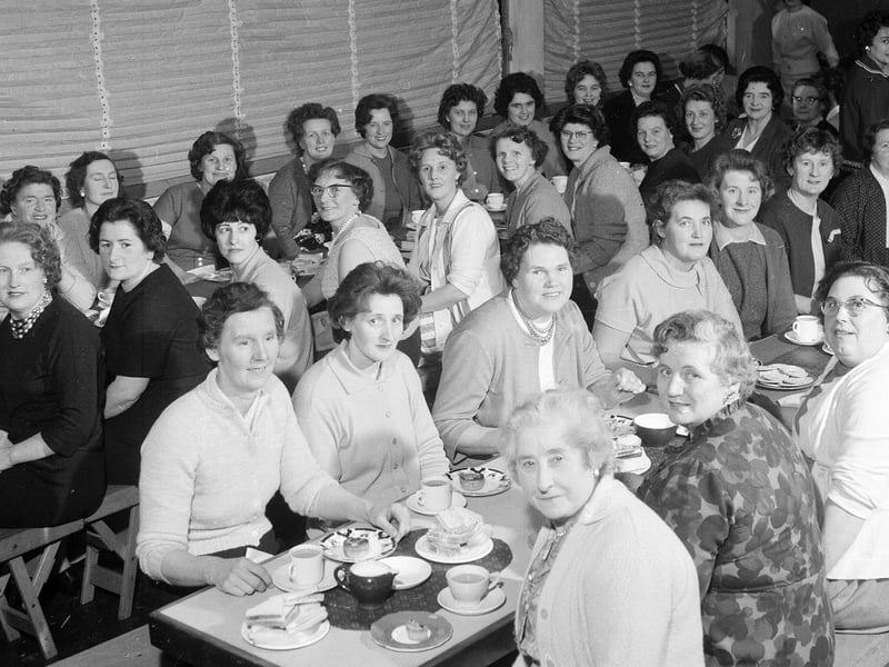 The Gilmerton Dykes Womens Guild hold a Scots night in Hyvots Bank Primary School in December 1964.