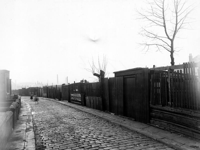 This photo from November 1950 looks south west along Back Cross Green Crescent with two children playing on the cobbled street.