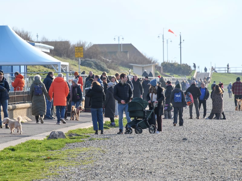 A busy seafront with people getting some fresh air on Boxing Day at Lee-on-the-Solent beach.