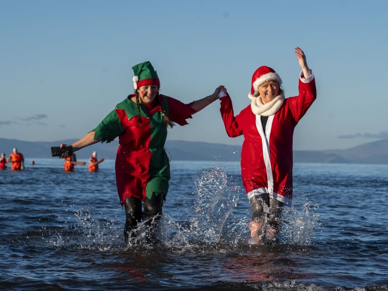 Swimmers are encouraged to dress up for the annual dip, with many sticking with the Christmas theme 