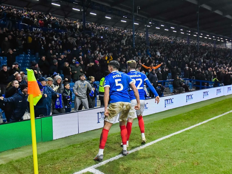 Regan Poole and Zak Swanson celebrate with fans in front of the North Stand.