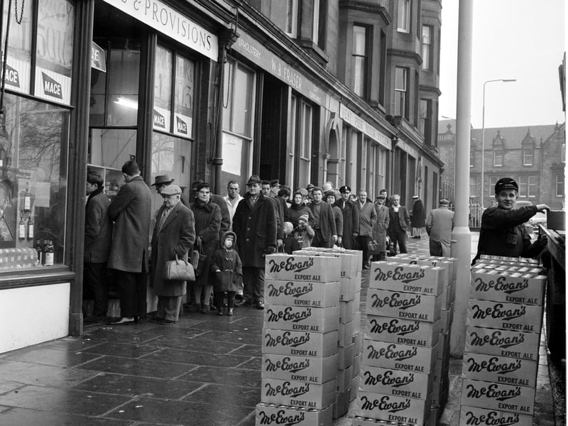 Queuing for Hogmanay supplies at Mr Munro's shop in Edinburgh's Brandon Terrace in 1965.