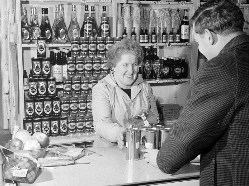 A customer stocks up for Hogmanay in HJ Hildersley Licensed Grocer in Edinburgh in December 1964.
