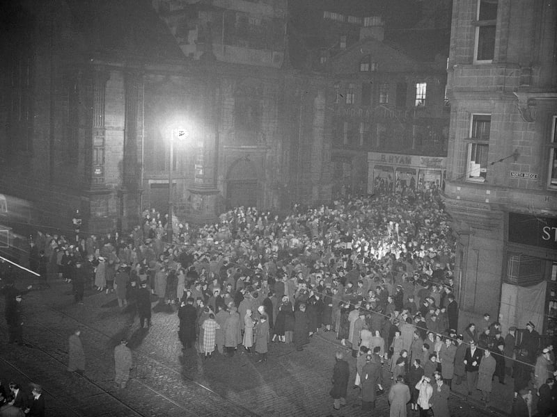 Hogmanay crowds gather at the Tron in Edinburgh in 1954.