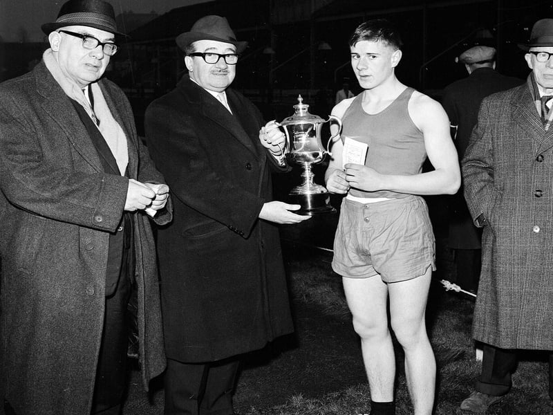 Mr J Harris presenting cup to D Hendrie - the winner of the youths 100 yards handicap at the Powderhall New Year Sprint in 1965.