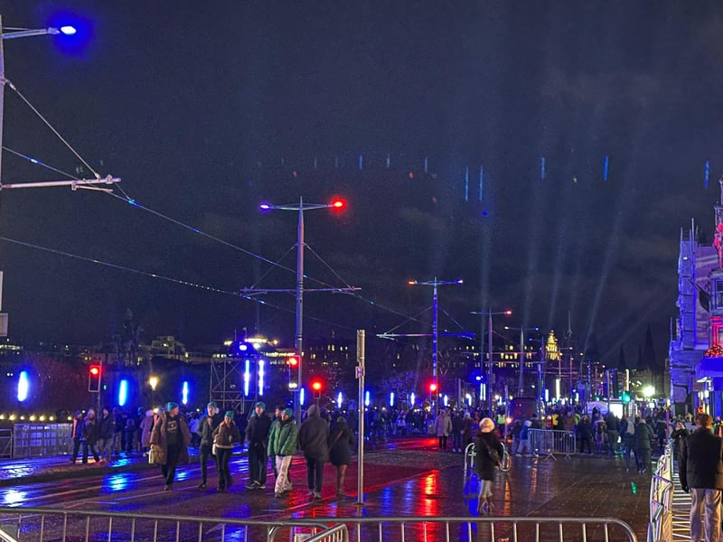 Early revellers wander along Princes Street before it was closed ahead of the official 8pm start for the street party