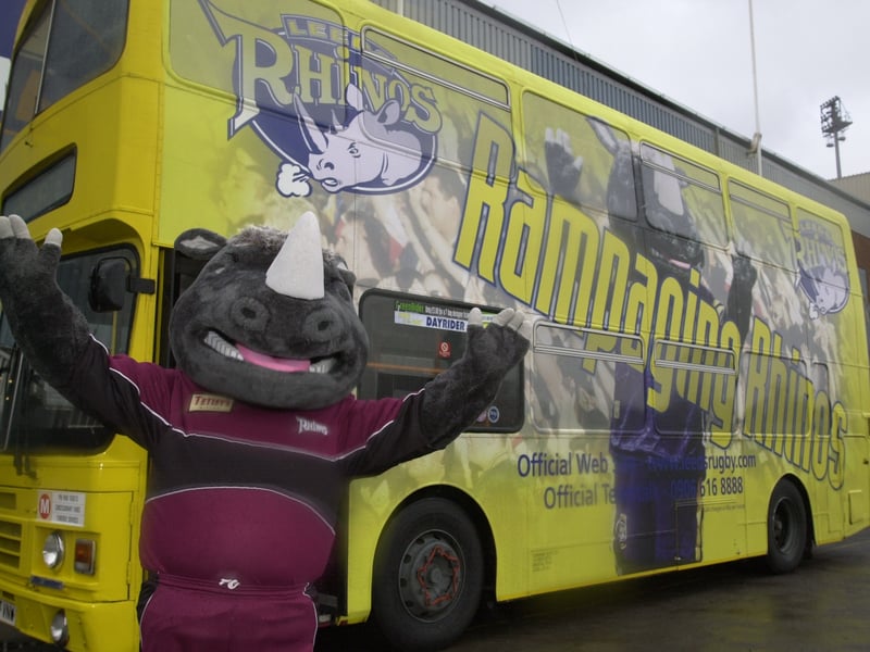 Ronnie the Rhino at the launch of the new  service bus, decorated in the club's colours.