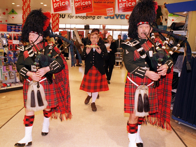 The haggis is piped into Sainsbury's Savacentre at the White Rose Centre. Pictured are two pipers from the City of Leeds Pipe Band Jeff Nixon, left, and John Grant as the haggis bearer Tony Lancaster brings in the haggis as part of the Burns Night celebrations.