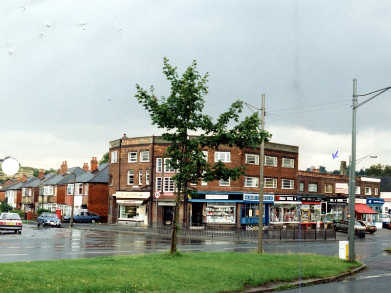 The junction of Selby Road and Dunhill Rise, showing a row of shops numbered 43-55 Selby Road, including Wray's Hardware and DIY, Hair Express, a wool shop and a chemist. Pictured in October 1985.