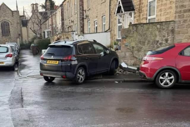 A car hit a wall in icy conditions on Talbot Place.