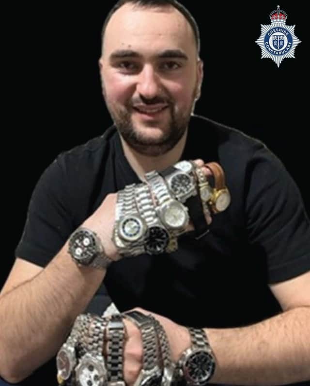 Sidorjan Lleshi, posing with stolen watches