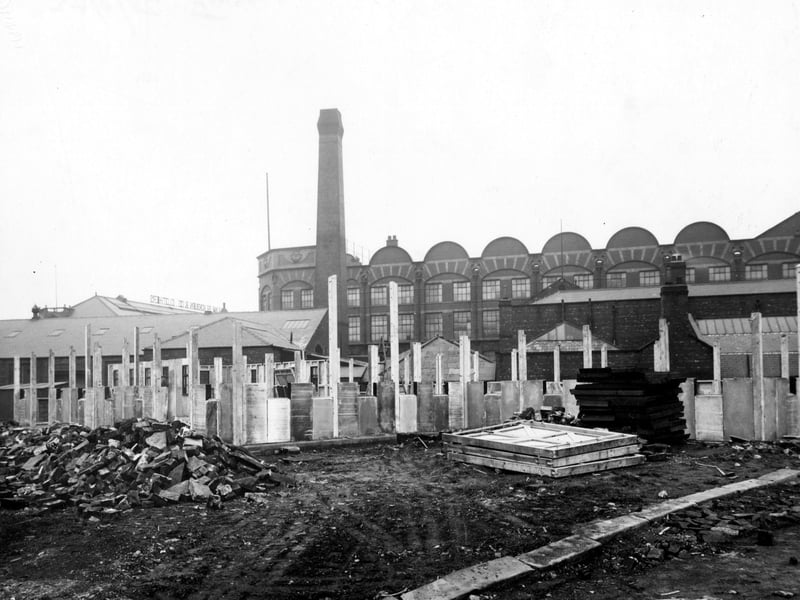 A British Restaurant, a cheap public eating place during World War II, under construction on Whitehall Road in November 1942. Wm. Blackburn and Co. Ltd. clothiers can be seen in the background on Springwell Road.
