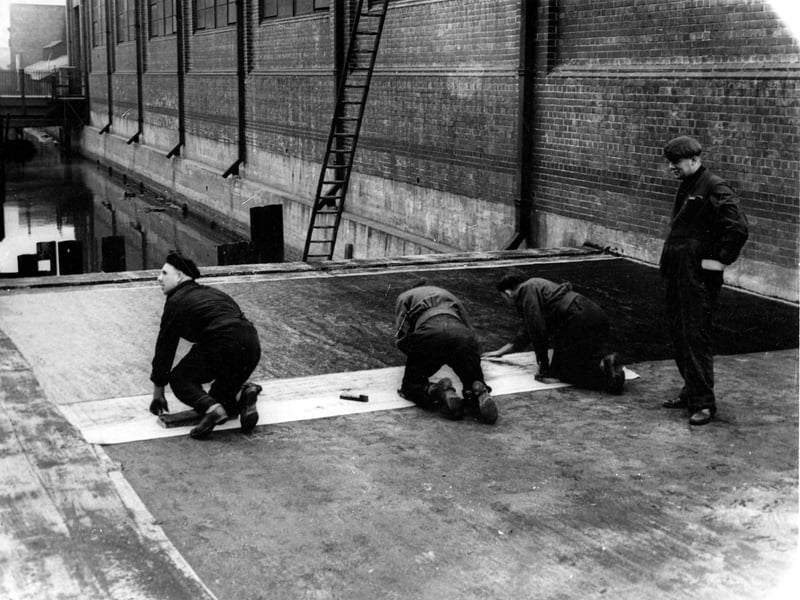Workmen finishing foundations of extension for R W Crabtree & Sons at Water Lane in March 1945. Hol Beck runs at the side of the factory and under the new foundations. A small bridge from Water Lane over Hol Beck to the factory is in the background.