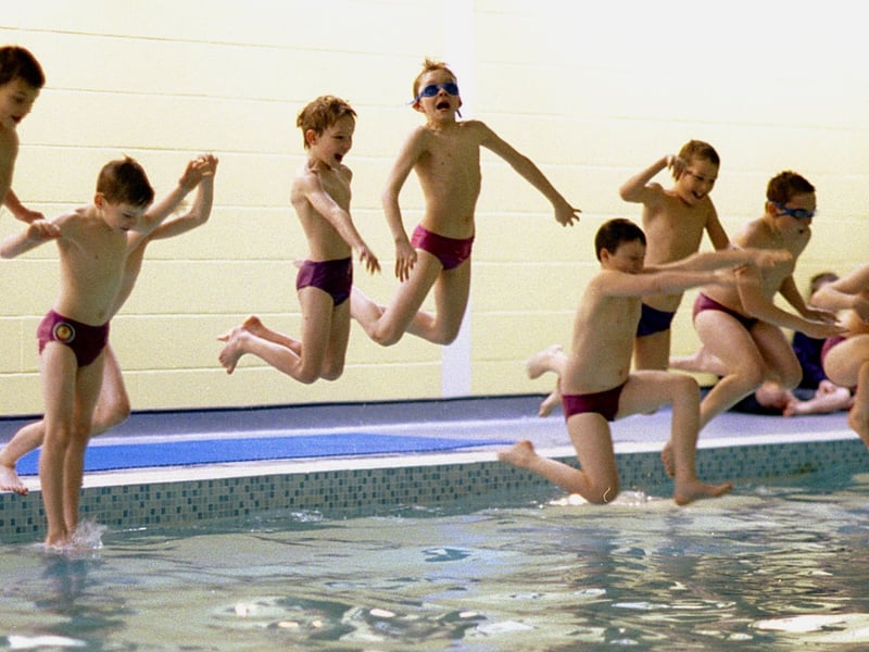 Splashing out. Pupils from Moorlands School dive in  after the opening of their purpose built swimming pool.