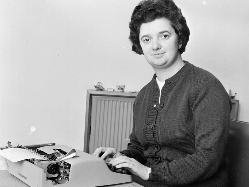 Miss McLeod at her portable typewriter presented by members of Granton Baptist Church in December 1964.