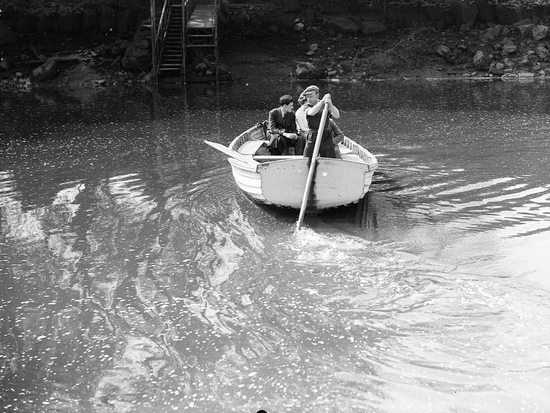 Day trippers a rowing boat across the River Almond from Granton to Cramond in December 1951.