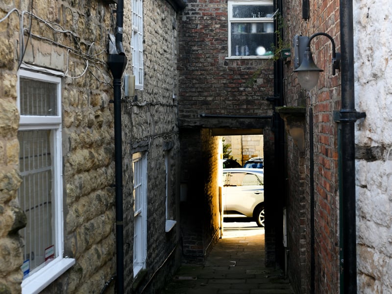 A ginnel, or gennel, as suggested by Jo Rixon, is the narrow alleyway running between terraced houses. There's some debate about the precise difference between a ginnel and a snicket, with the general consensus being that a ginnel is a path running between houses and usually covered, while a snicket is typically uncovered with hedges or bushes on either side.