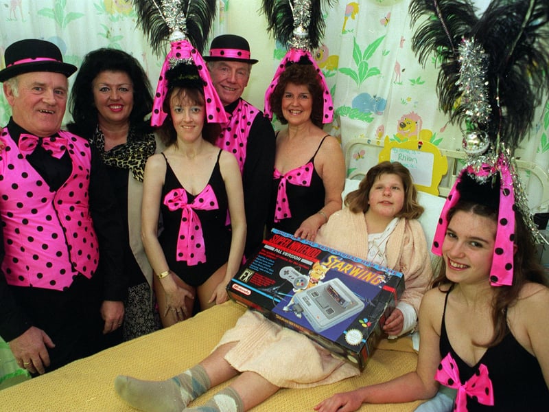 Showstoppers charity fundraising cabaret artists are pictured with Rhian Haskell in the LGI childrens surgical unit where they presented a Super Nintendo game. It replaced one that had been stolen from the ward. Pictured, from left, is Ken Eagleton, Jill Robinson MBE, Julie Lipscombe, Bernard Kelly, Margaret Bretherick and Julie Webster.