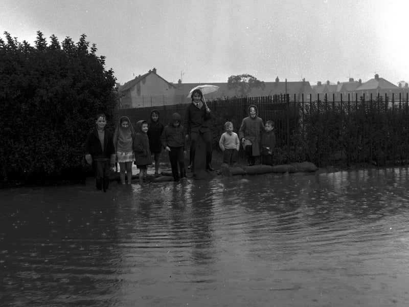 Children enjoy the flooding at Broomhill in October 1965.