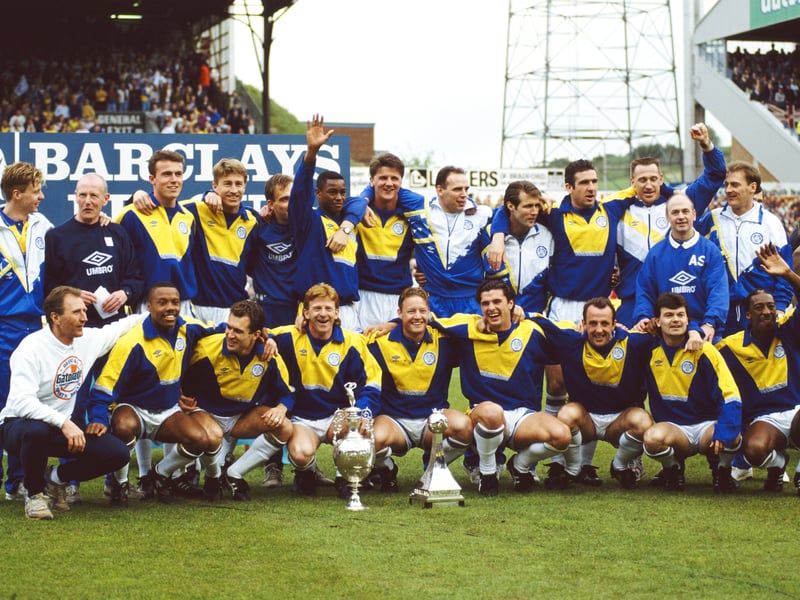 Leeds United captain Gordon Strachan with the Football League Division One trophy for the 1991/92 season, as players including Eric Cantona and Gary Speed celebrate at Elland Road in May 1992