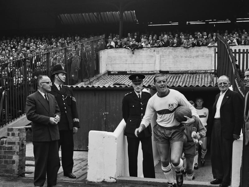 Barnsley's Oakwell Stadium in August 1963, with Millwall captain Harry Cripps pictured leading out his team during a League Division Three match, which ended 1-1