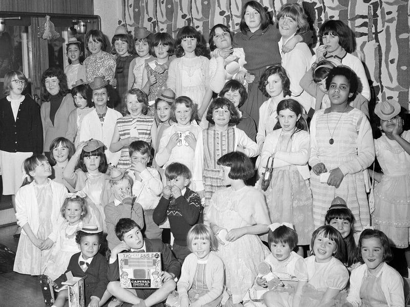 Orphans are given a Christmas treat by staff and customers of the Sighthill Inn in December 1964.