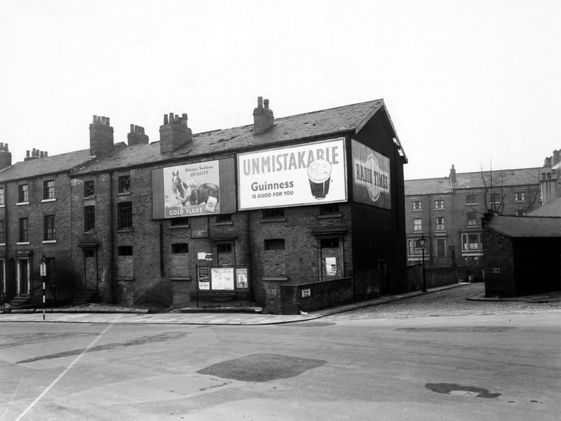 Fenton Street at the junction with Fenton Place, looking north-west in November 1950. The three nearest properties have their doors and windows bricked up. 