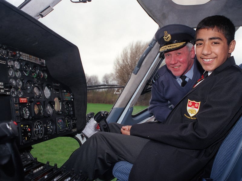 Sir Anthony Bagnall and Rizawan Khan in the Twin Squirril helicopter at Mirfield Free Grammar School in November 1999.