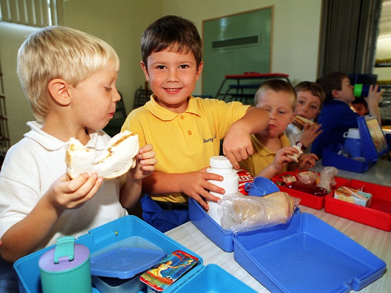 The packed lunch brigade. Two pupils from the Battyeford Primary School dive into their home made lunches in November 1995.