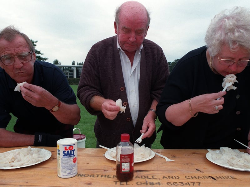 Trying to eat with their mouths full. Competitors pictured during the tripe eating competition at Mirfield Show in August 1998.