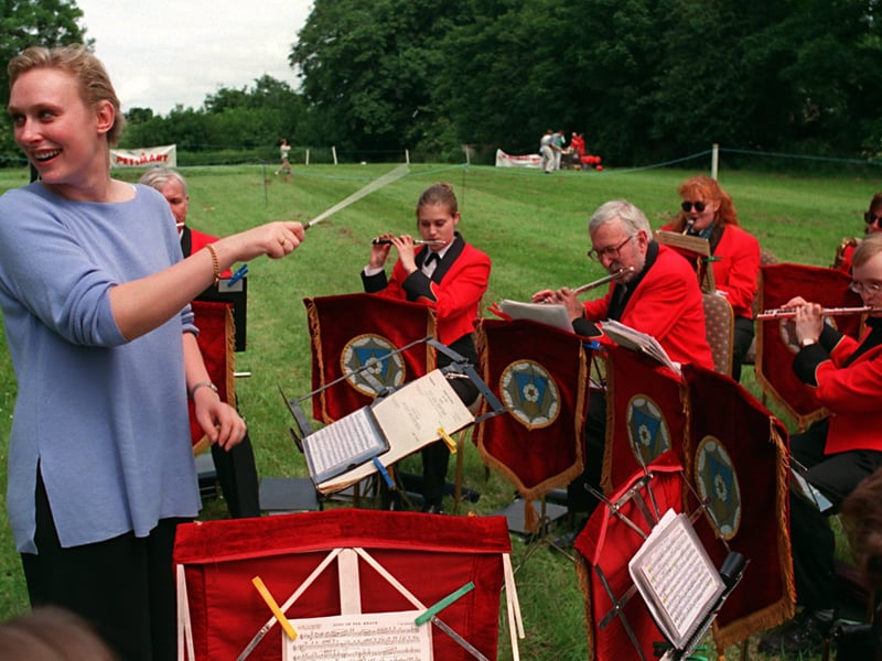  TV weather girl Debbie Lindley had a spell at conducting the West Yorkshire Fire Service Military Band  after she officially opened the 1st Annual Gala & Craft Fair of the Huddersfield & Kirklees Branch of the Multiple Sclerosis Society at Marmaville Country Club in July 1999.