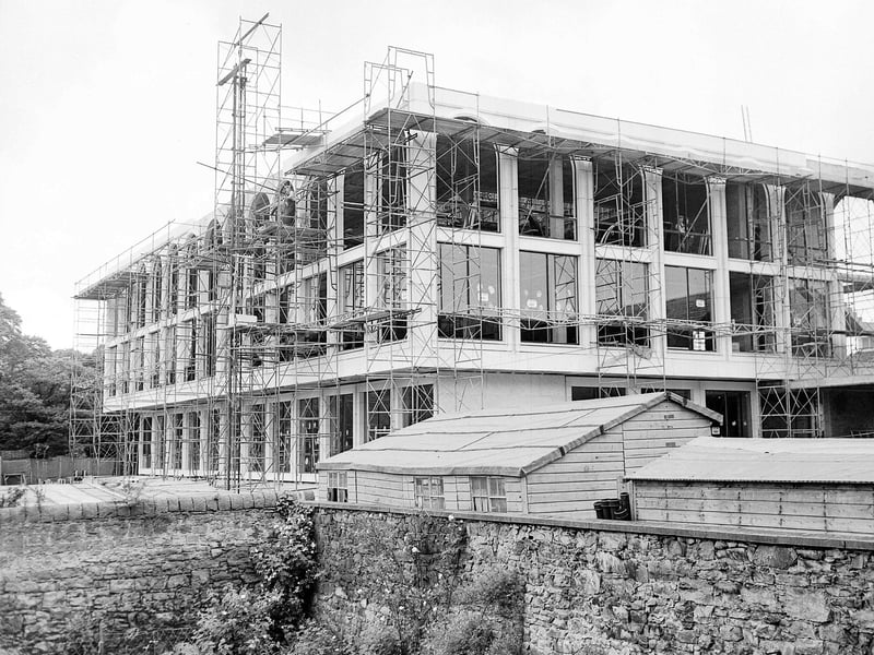 Scaffolding surrounds the frame of the new herbarium at the Royal Botanic Gardens in July 1963.