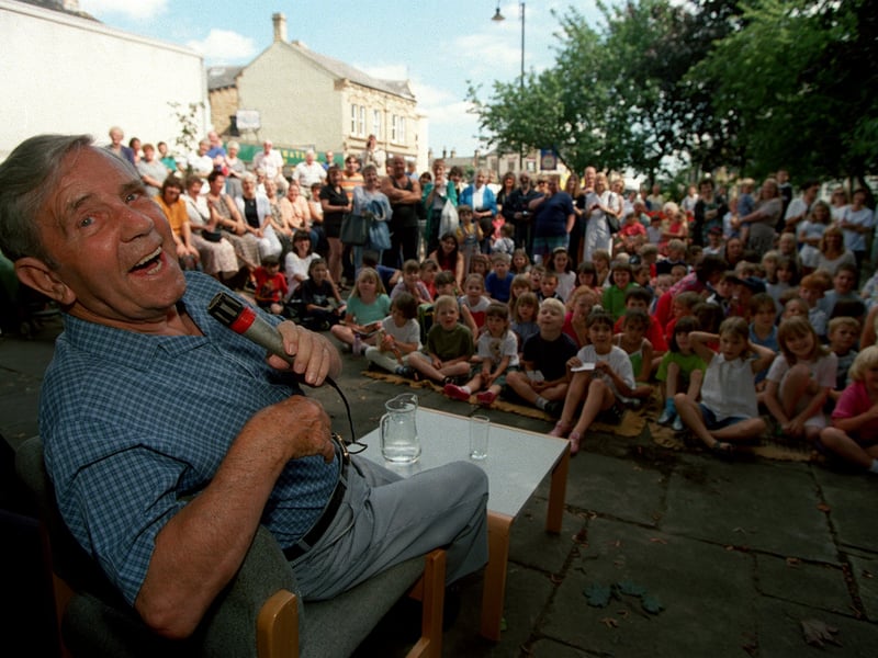 Comedian Norman Wisdom pictured at Mirfield Library where he read out a story to the gathered children in August 1997.