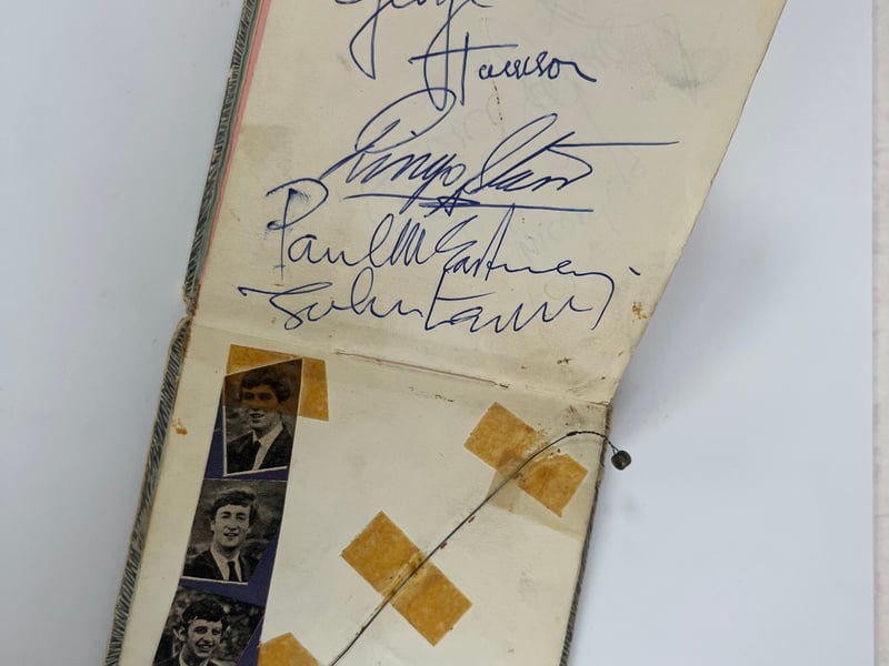 John Lennon, Paul McCartney, George Harrison and Ringo Starr signed after a gig in Southsea 1963. Affixed next to the autographs is George’s guitar string snapped that same night.