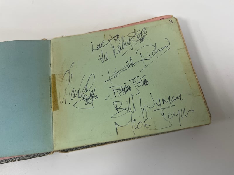 The complete set of Rolling Stones’ signatures in the album, including Brian Jones.