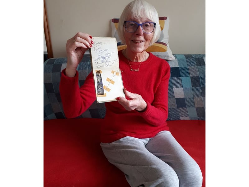 Elizabeth Salt with her autograph album.