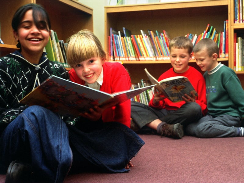 January 1996 and pupils aged 9 and 10 at Old Bank Junior and Infants School were helping teach some of the younger children to read. Pictured, from left, are Surraya Patel, Natasha Hamilton, Morgan Barker and George Marshall.