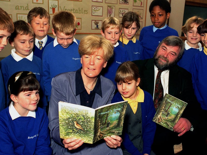 November 1995 and Dewsbury MP Ann Taylor reads Nancy's Song with some of the pupils at Battyford Junior School. Also pictured is author Bill Forde.