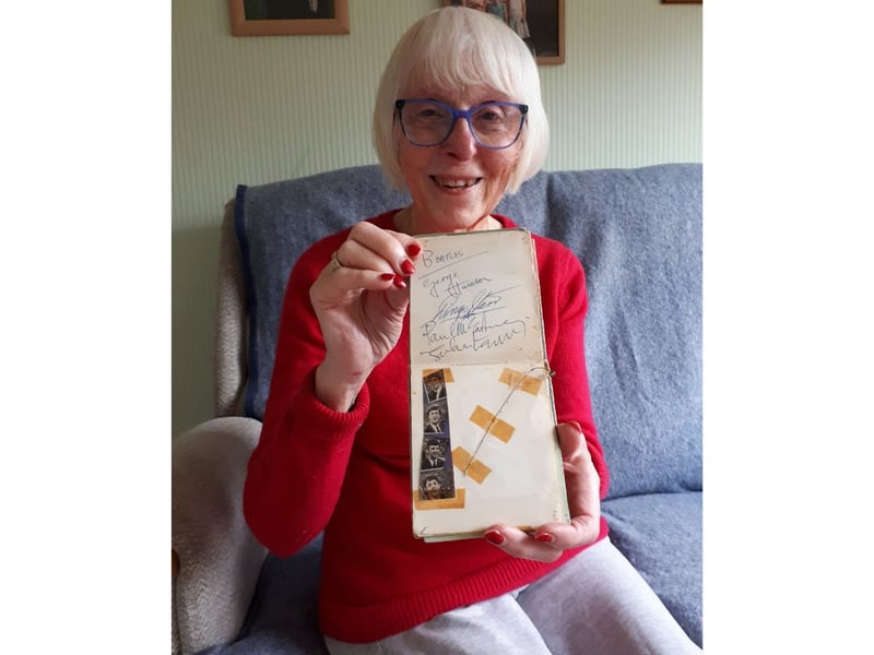 Elizabeth Salt, 79 of Lichfield, with her autograph book stuffed full of 60s icons that she collected as teenager in Portsmouth.