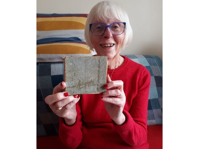 Elizabeth Salt with her autograph album.