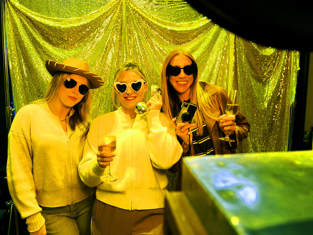 Naomi Tilsley (centre), who is getting married, pictured with stepdaughter Olivia Clayton and bridesmaid Leona Towell in the photobooth.