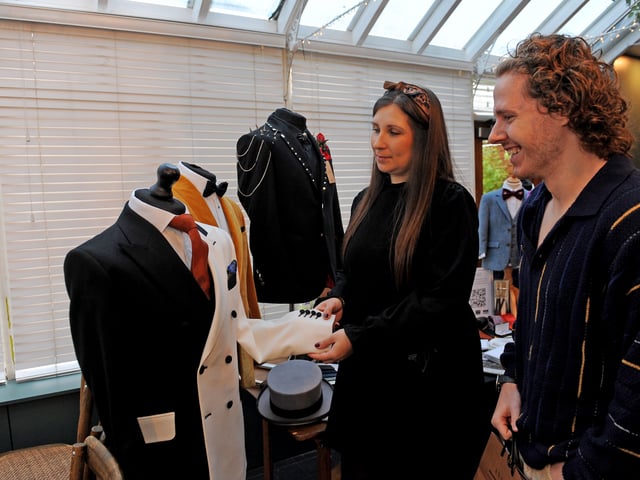 Stacey Harrison-Doran of Antich Fine English Tailors, Huddersfield, with Jonny Bark of Horsforth looking at wedding suits.