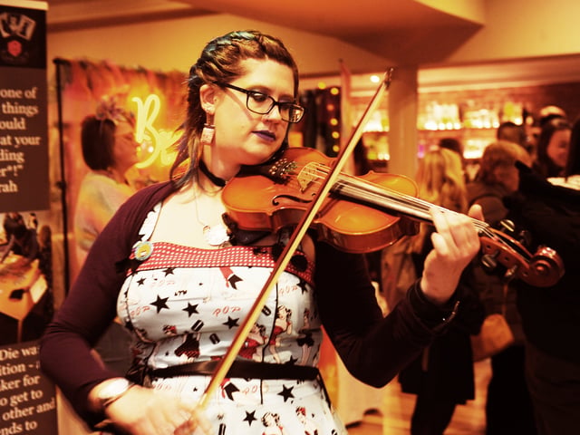 Wedding musician Alice Nicholls, from Headingley, entertains the fayre. 