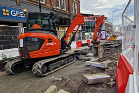 Digger on Pinstone Street, where road works continue.
