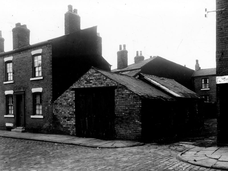 Greystone Street is on the left, next an outbuilding which is at the corner with Atack Street. At the end of the yard is 39 Greystone Street, a detached house. Pictured in  November 1959.