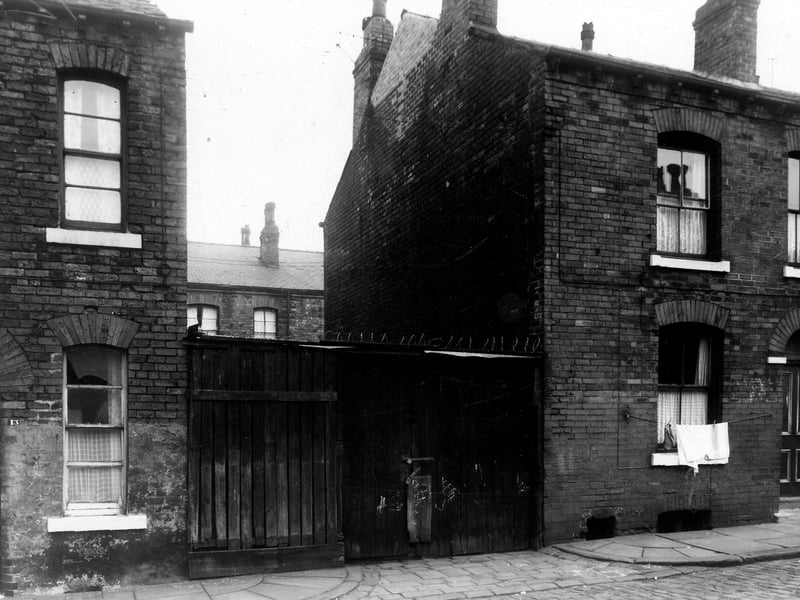 Thornton Street is partially in view on the left. To the right is 15. The gap between the houses is occupied by a wooden shed. Darnborough Street is just visible behind the shed.