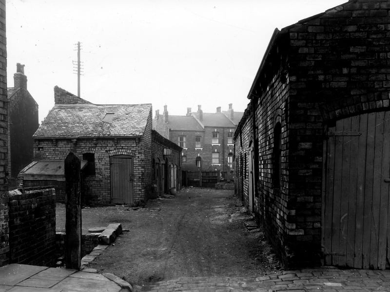 A view to the end of Upper Greystone Street, buildings which have possibly been stables can be seen. The houses in the centre are numbers 4 and 6 Olive Grove. Pictured in November 1959.
