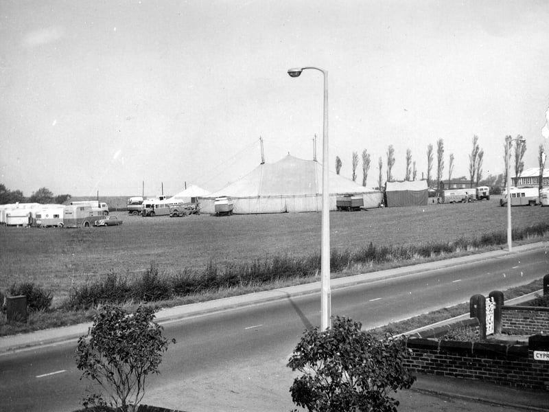 Wakefield Road showing the tents and caravans of a travelling circus set up in a field on the north-west side in October 1962. The junction with Cyprus Road is seen in the bottom right corner.