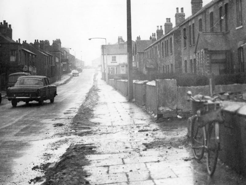 Main Street showing a row of houses known as Colliery Row taken shortly before demolition. Pictured in January 1963.