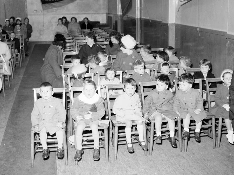 Children hand over gifts to the Musselburgh Sailors Mission as part of the Annual Harvest Festival in October 1963.